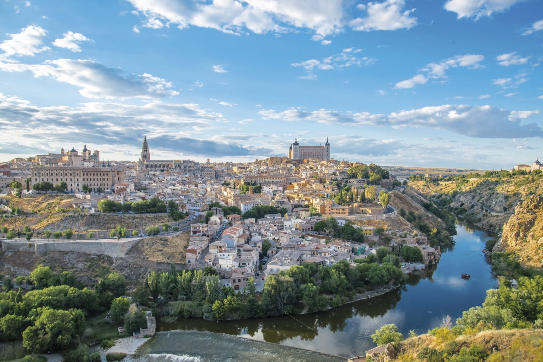 Panoramic view of the historic city of Toledo with river Tajo at sunset in Castile-La Mancha, Spain