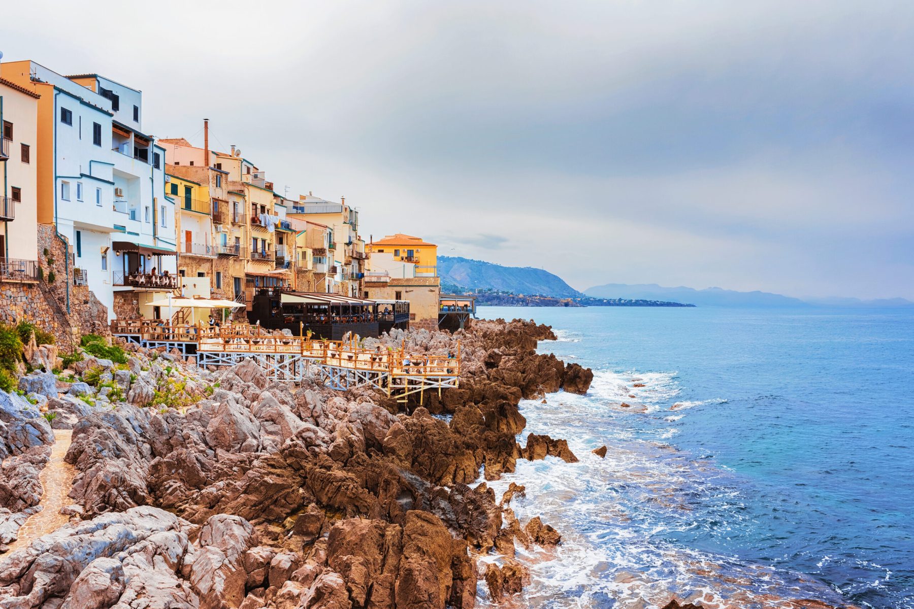 Restaurant at Rocky Coast of Cefalu old town, Palermo region, Sicily island of Italy
